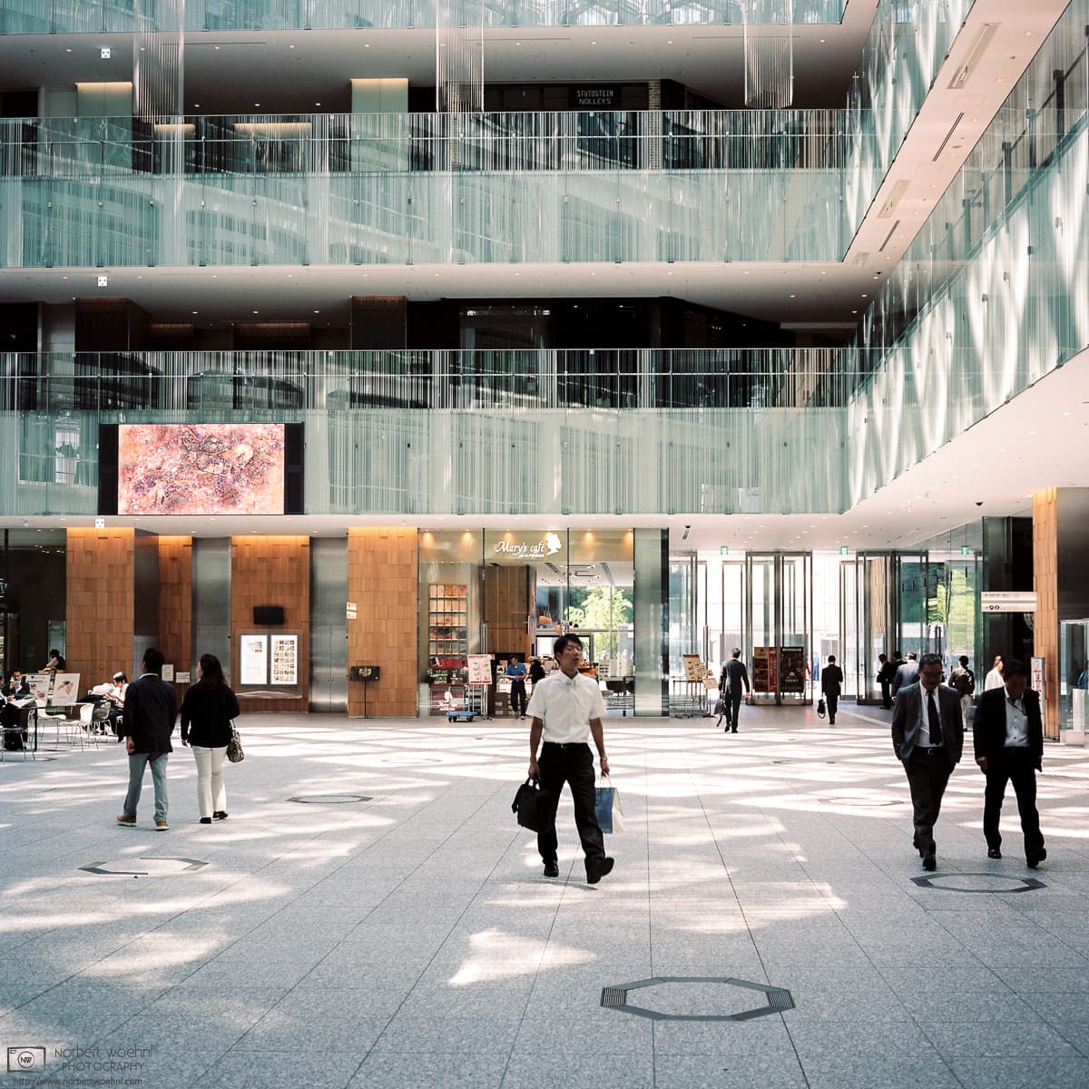 Striding across the JP Tower Lobby, Tokyo, Japan Photo