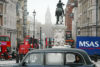 A taxi passenger taking in a view of the surroundings on Trafalgar Square, London, England.