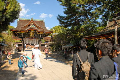Students of different ages are visiting the grounds of Kitano Tenmangū Shrine (北野天満宮) in Kyoto, Japan.