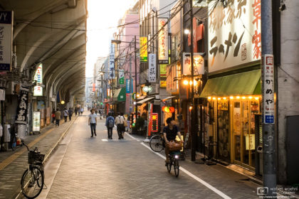 Passersby checking out Ramen restaurants in the Asakusabashi area of Tokyo, Japan.