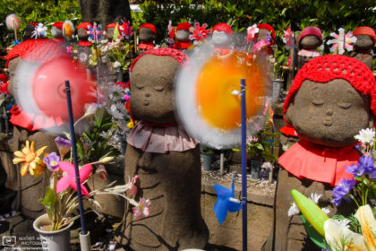 Jizo Statues at Zojoji Temple in Tokyo, Japan. Jizō is seen as the guardian of children - in particular, children who died before their parents - and is believed to help their souls reach paradise.