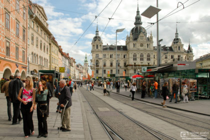 A lively scene from the Hauptplatz (Main Square) in the historic Old Town of Graz, Austria.