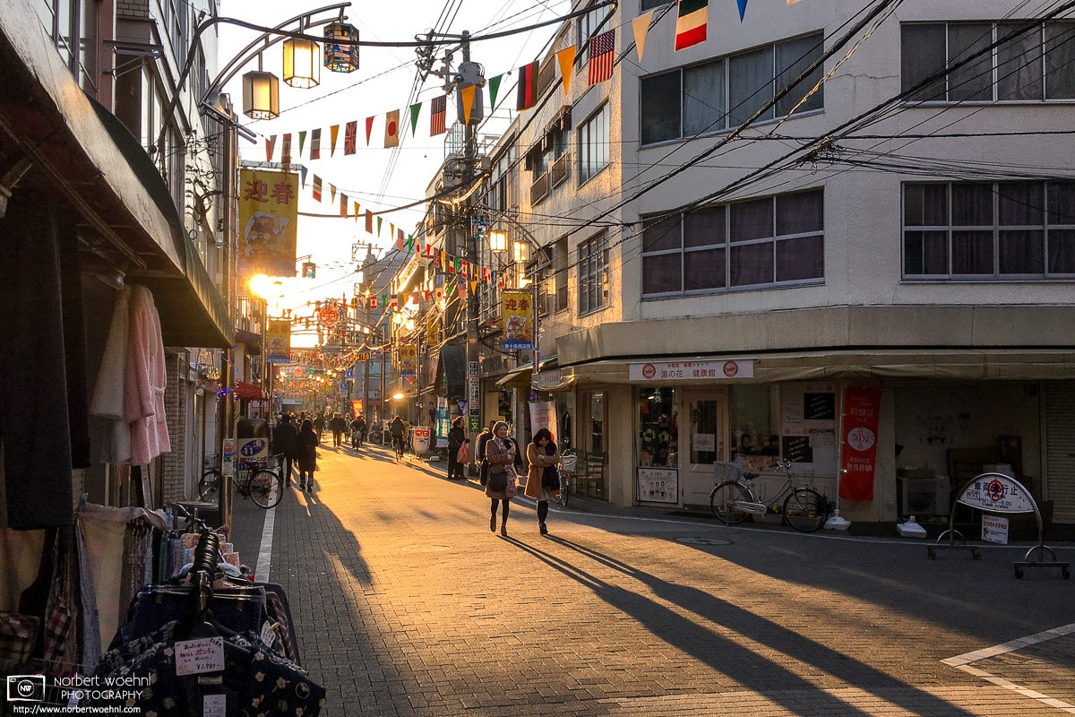 A fine mood created by the setting sun along Higashi-Jujo Shopping Street in Tokyo, Japan.