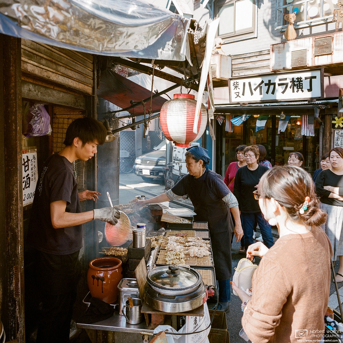Scene from a Yakitori Stand in the traditional Shibamata (柴又) area in the northeast of Tokyo, Japan.