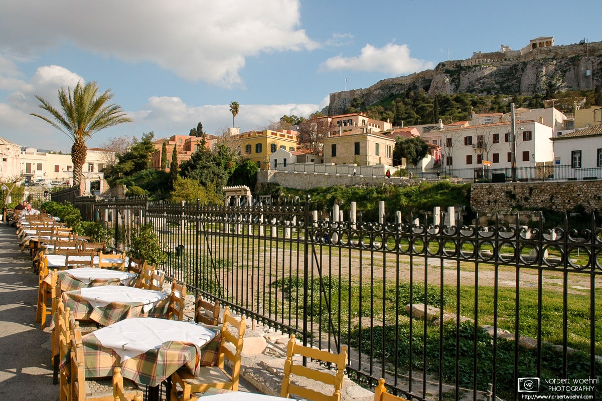 The tables are all set and awaiting customers at this restaurant adjacent to the Roman Agora in Athens, Greece.