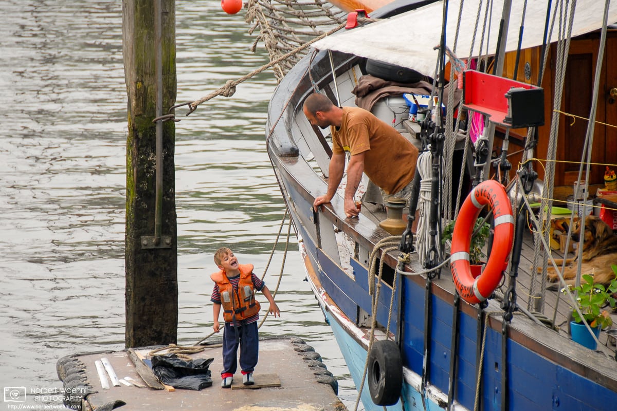 Walking around a small boat harbor in Rotterdam, The Netherlands, I ran into this discussion between father and son.