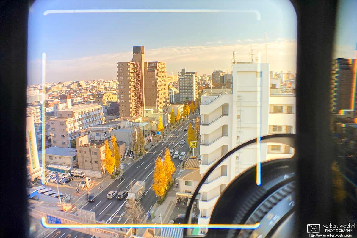 View through the Mamiya 6 viewfinder (with framelines for 50mm lens) - the scenery is a southbound view from my apartment in Tokyo.