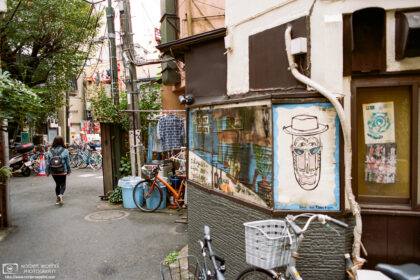 A makeshift exhaust pipe and a brick-pattern shirt are just two of the many details to be found in this scene from a street corner in Nakano, Tokyo, Japan.