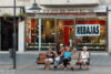 Ladies enjoying a summer afternoon chat in a quiet residential and shopping area of Madrid, Spain.