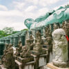 Statues and decorative elements around the Reclining Buddha at Nanzoin Temple in Sasaguri, Fukuoka Prefecture, Japan.