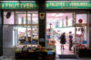 Late shoppers at a greengrocer's in the Sant Gervasi - Galvany neighborhood of Barcelona, Spain.