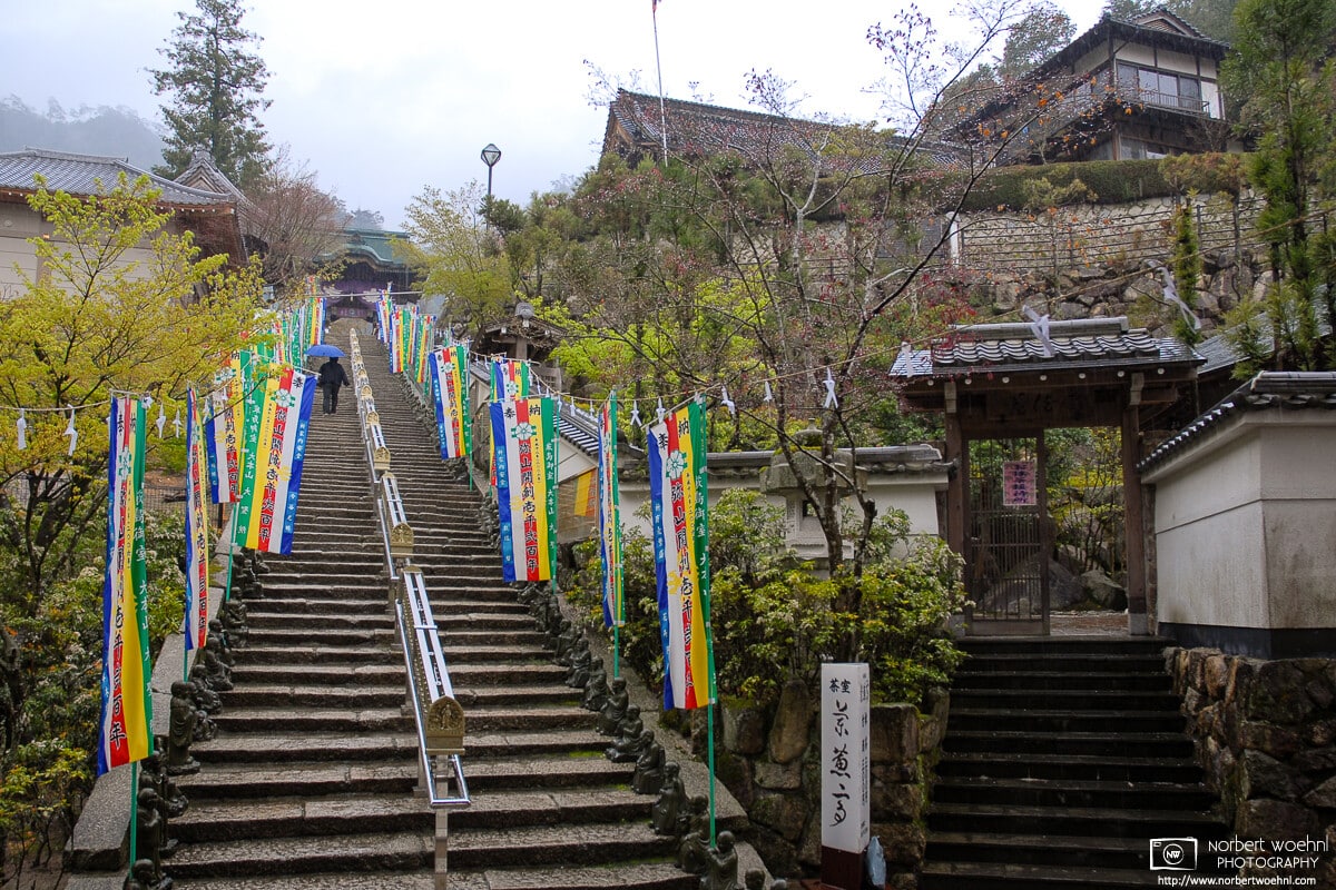 A rainy day for climbing the stairs to the main premises of Daishoin Temple on Miyajima Island in Hiroshima Prefecture, Japan.
