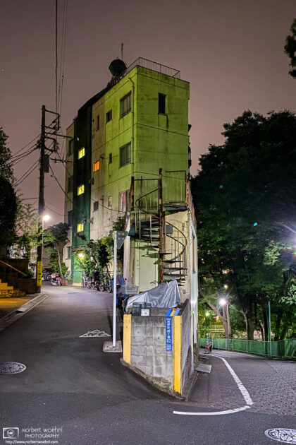 A distinctively shaped building fills the space inside a hairpin turn in the Itabashi ward of Tokyo, Japan.
