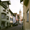 View along a line of old houses towards Kapellenkirche, one of the churches in Rottweil, Germany.