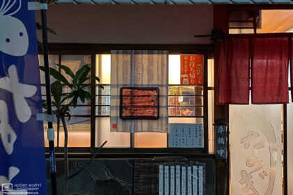A customer is seen through the window of a grilled-eel restaurant in Itabashi-ku, Tokyo, Japan.