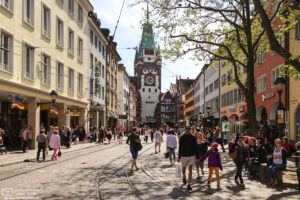 View towards Martinstor (Martin's Gate) in the city center of Freiburg im Breisgau, Germany.
