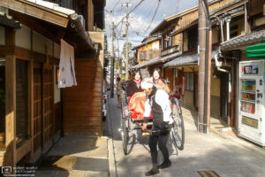 Tourists are enjoying a jinricksha tour in the Higashiyama area of Kyoto, Japan.